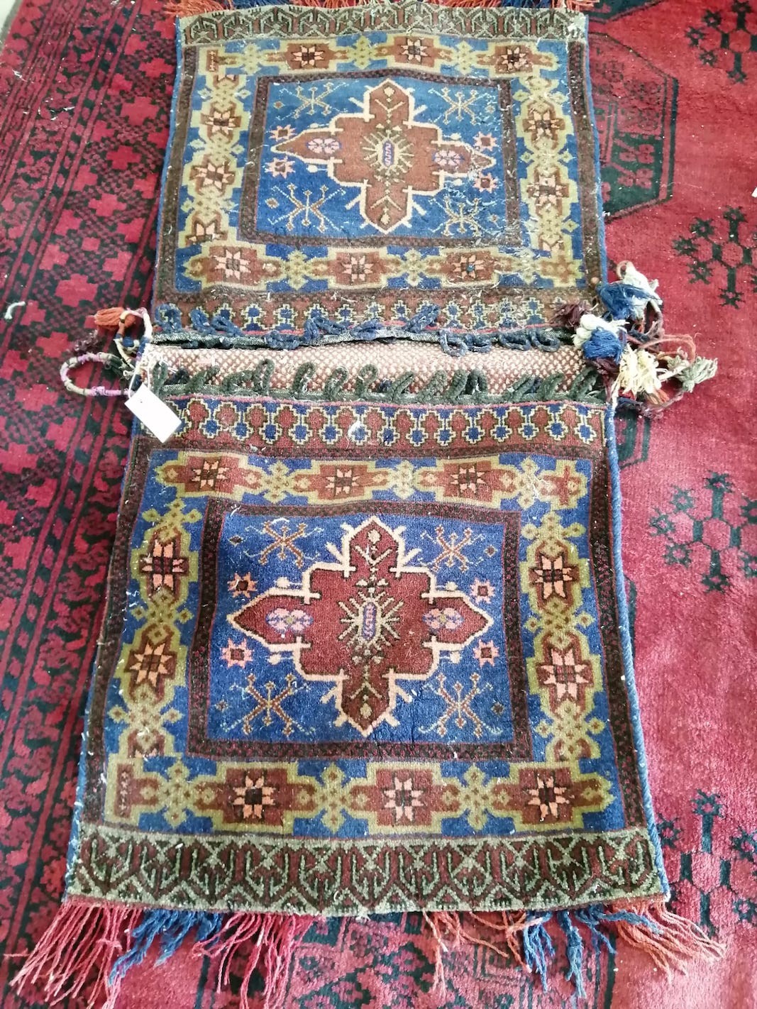 A Caucasian blue ground saddle bag, 120 x 60cm